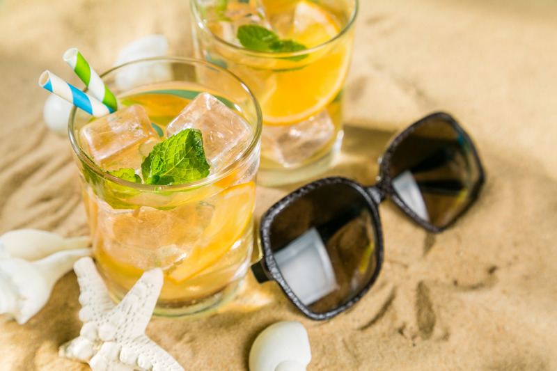 Summer drink on sand beach